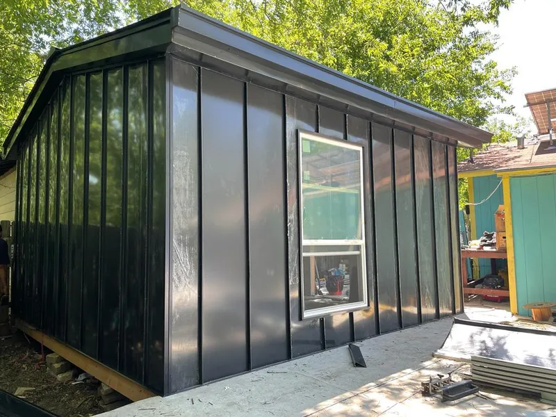 Black standing seam metal wall panels for Roof Inspection in Woodinville