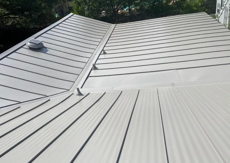 Solar attic fan installed on a metal roof for Roof Ventilation in Woodinville